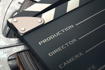 Filmklappe mit Filmrolle - Filme machen ohne Studium